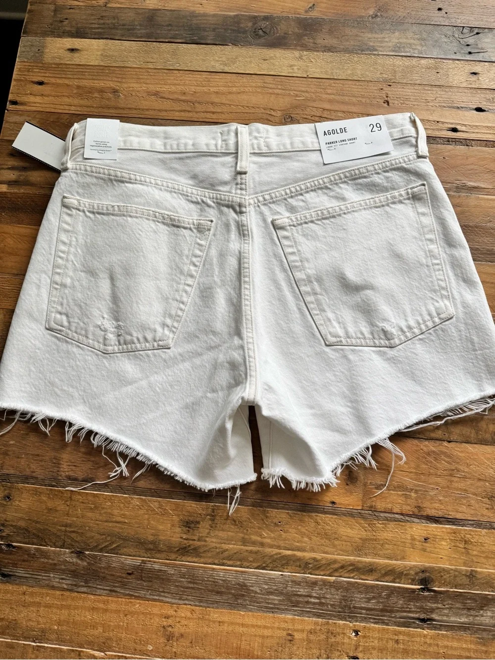 Agolde Parker Long Jean Shorts in Panna Cotta.
